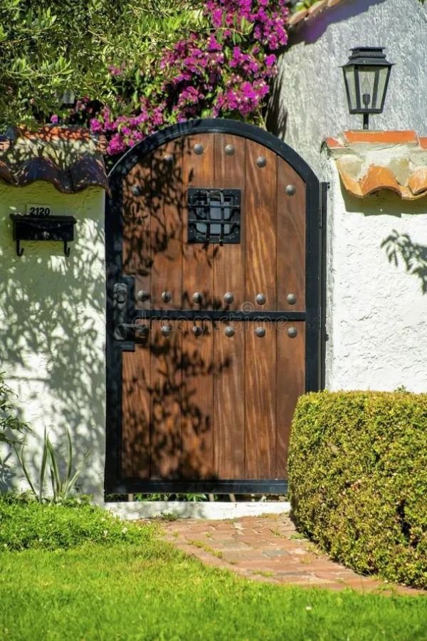 Wooden Brown Gate with Black Metal Trim with Path