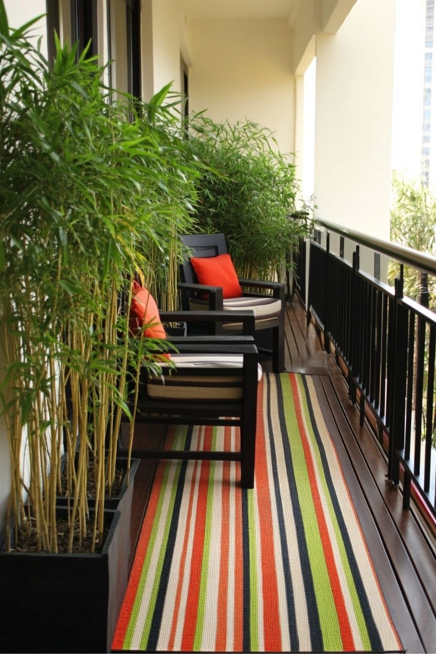 Enhance Balcony Privacy with Bamboo Planters and Vibrant Decor